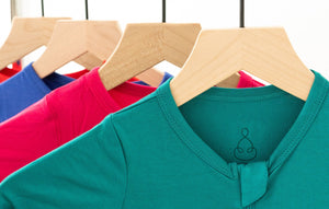 colored bamboo rompers on hangers